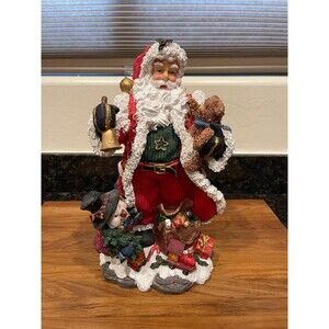 12.5" Resin Santa With bell and Bear